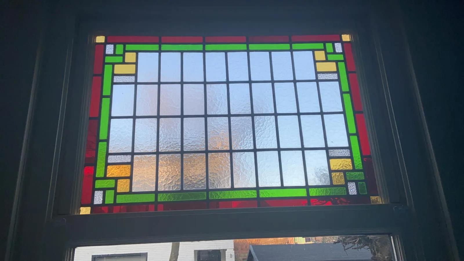 Groen geel glas in lood raam